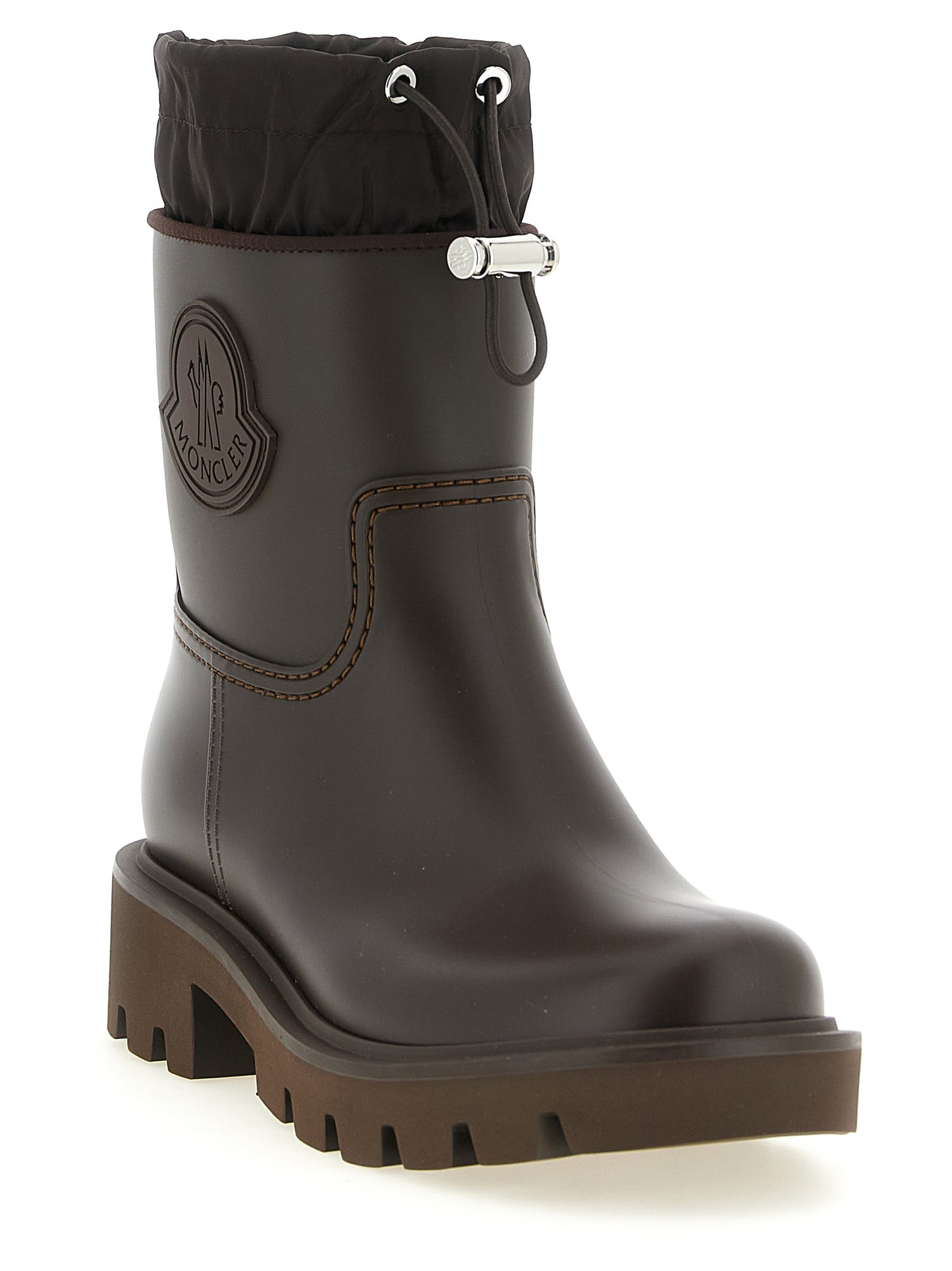 Ankle Boots by Moncler for women in pvc brown & silver features an dynamic silhouette, showcasing the dynamic Women's PVC Ankle Boots design with its distinctive and elegant .