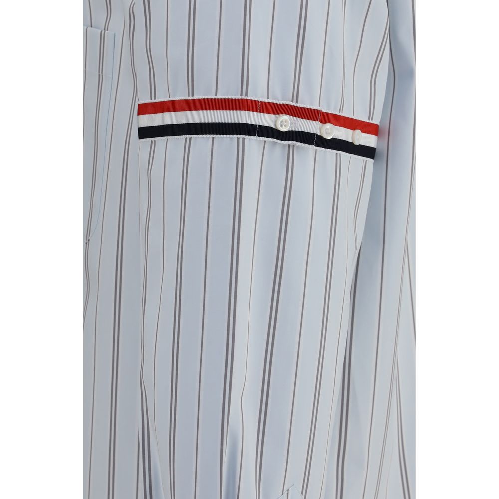Dress Shirt by Thom Browne for men in cotton blue, signature & striped features an architectural silhouette with a refined and elegant for a architectural look.