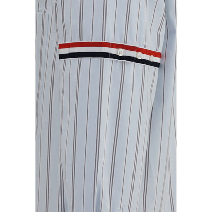 Dress Shirt by Thom Browne for men in cotton blue, signature & striped features an architectural silhouette with a refined and elegant for a architectural look.