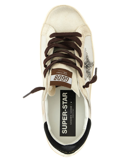 Sneakers by Golden Goose for women in bos taurus suede cowhide leather black, gold, multicolor & white presents a sumptuous silhouette, artfully capturing the essence of the Pony Star Women's Low Top Bos Taurus Suede Cowhide Leather Sneakers with its sumptuous low-top style design.