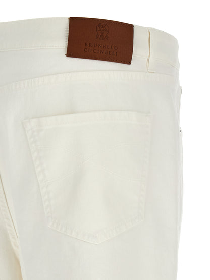 Jeans by Brunello Cucinelli for men in stretch denim cotton brown & white presents a refined pantology silhouette, artfully defined by a refined pantology cropped, cropped, and a sophisticated .