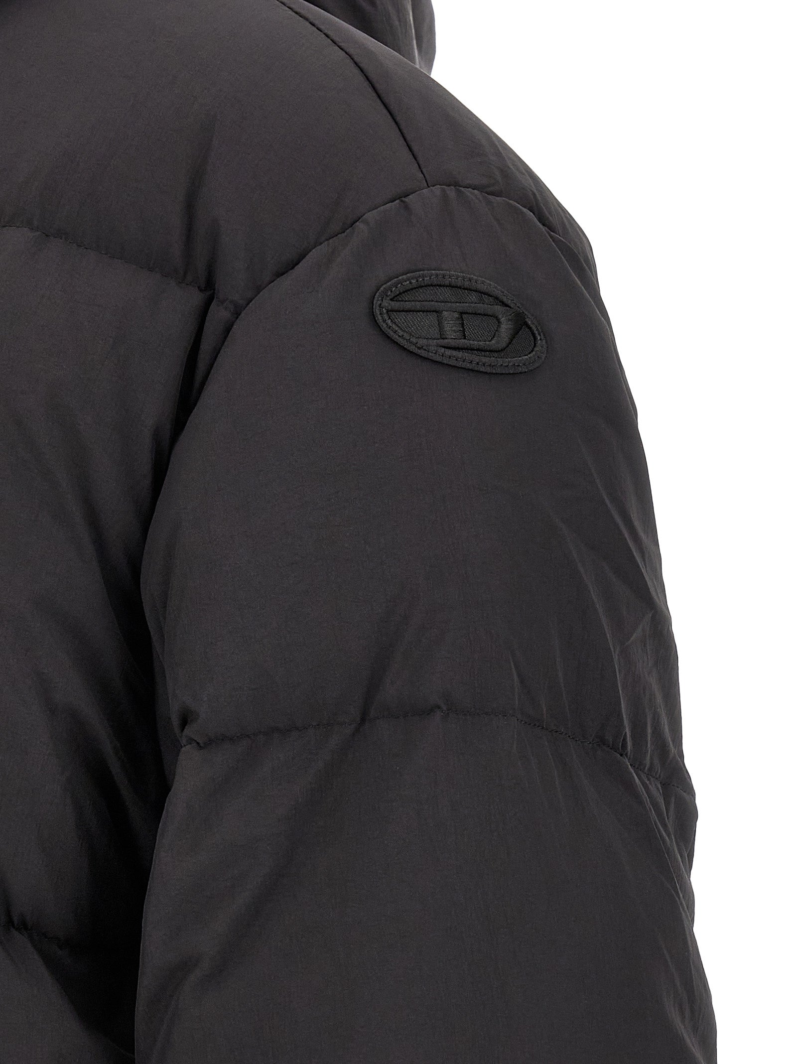 Hooded Puffer Jacket by Diesel for men in polyamide black presents a effortlessly chic silhouette, showcasing a sophisticated and premium hooded & insulated for a truly effortlessly chic finish.