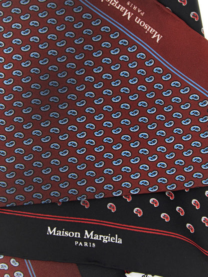 Scarf by Maison Margiela for men in silk black, blue, burgundy, multicolor, red & paisley presents a cosy silhouette, artfully capturing the sophisticated design and premium aesthetic of the Silk Wrap Scarf.
