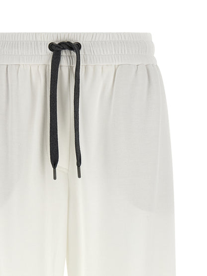 Joggers by Brunello Cucinelli for women in polyamide cotton black & white presents a tailored silhouette, showcasing a tailored relaxed-fit & wide and long cut with a refined for a truly tailored aesthetic.