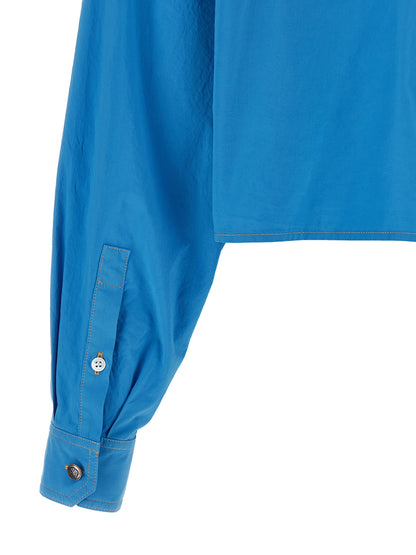 Blouse by Versace for women in cotton blue presents a discerning silhouette, showcasing a sophisticated and for a truly discerning finish.