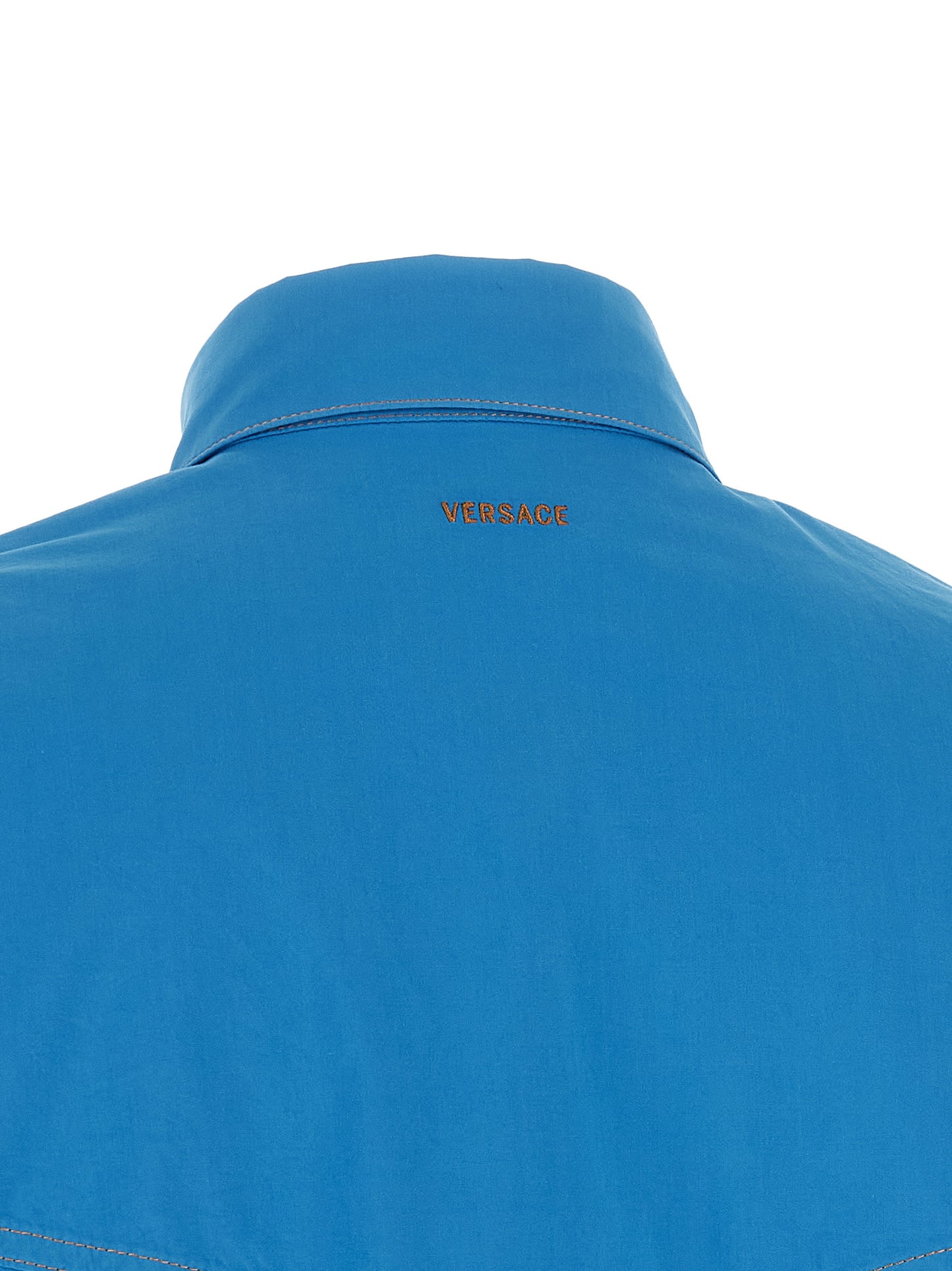 Blouse by Versace for women in cotton blue features an architectural silhouette with a refined and elegant for a architectural look.