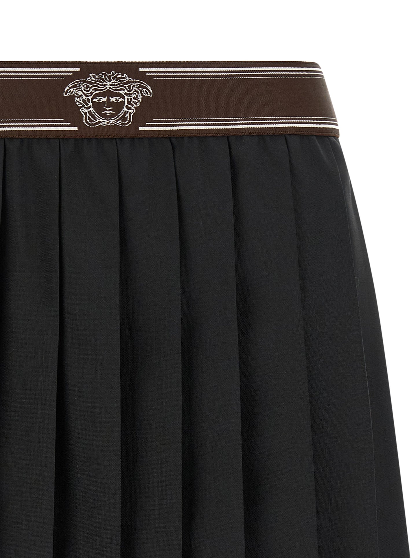 Skirt by Versace for women in mohair wool black, brown, white, jacquard & striped showcases a sultry silhouette, elegantly defined by its mini long and the sophisticated sultry design of the Medusa Women's Pleated Mohair Wool Skirt.