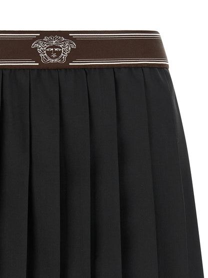 Skirt by Versace for women in mohair wool black, brown, white, jacquard & striped showcases a sultry silhouette, elegantly defined by its mini long and the sophisticated sultry design of the Medusa Women's Pleated Mohair Wool Skirt.
