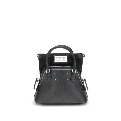 Shoulder Bag by Maison Margiela for women in bos taurus calf leather black, signature & monogram showcases a enviable silhouette, artfully detailed with a secure zipper, organized internal-pockets, and versatile shoulder-strap, handle & adjustable-strap for a enviable look.