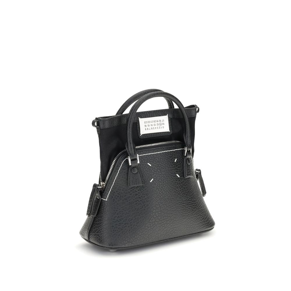Shoulder Bag by Maison Margiela for women in bos taurus calf leather black, signature & monogram features a enviable silhouette, showcasing a secure zipper, ample internal-pockets, and enviable shoulder-strap, handle & adjustable-strap for a enviable finish.