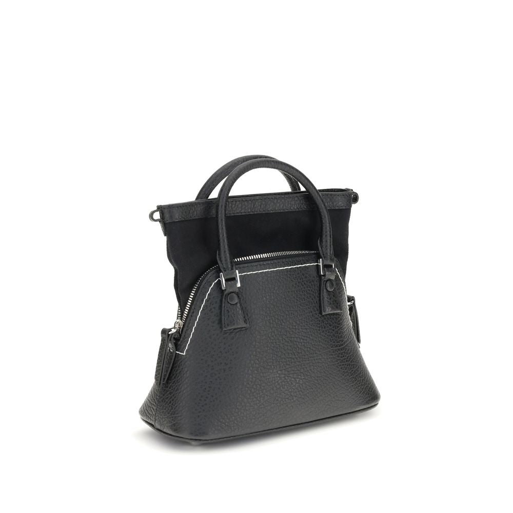 Shoulder Bag by Maison Margiela for women in bos taurus calf leather black, signature & monogram presents a versatile silhouette, showcasing a secure zipper and versatile internal-pockets with versatile shoulder-strap, handle & adjustable-strap for a sophisticated look.