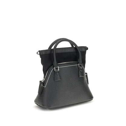 Shoulder Bag by Maison Margiela for women in bos taurus calf leather black, signature & monogram presents a versatile silhouette, showcasing a secure zipper and versatile internal-pockets with versatile shoulder-strap, handle & adjustable-strap for a sophisticated look.