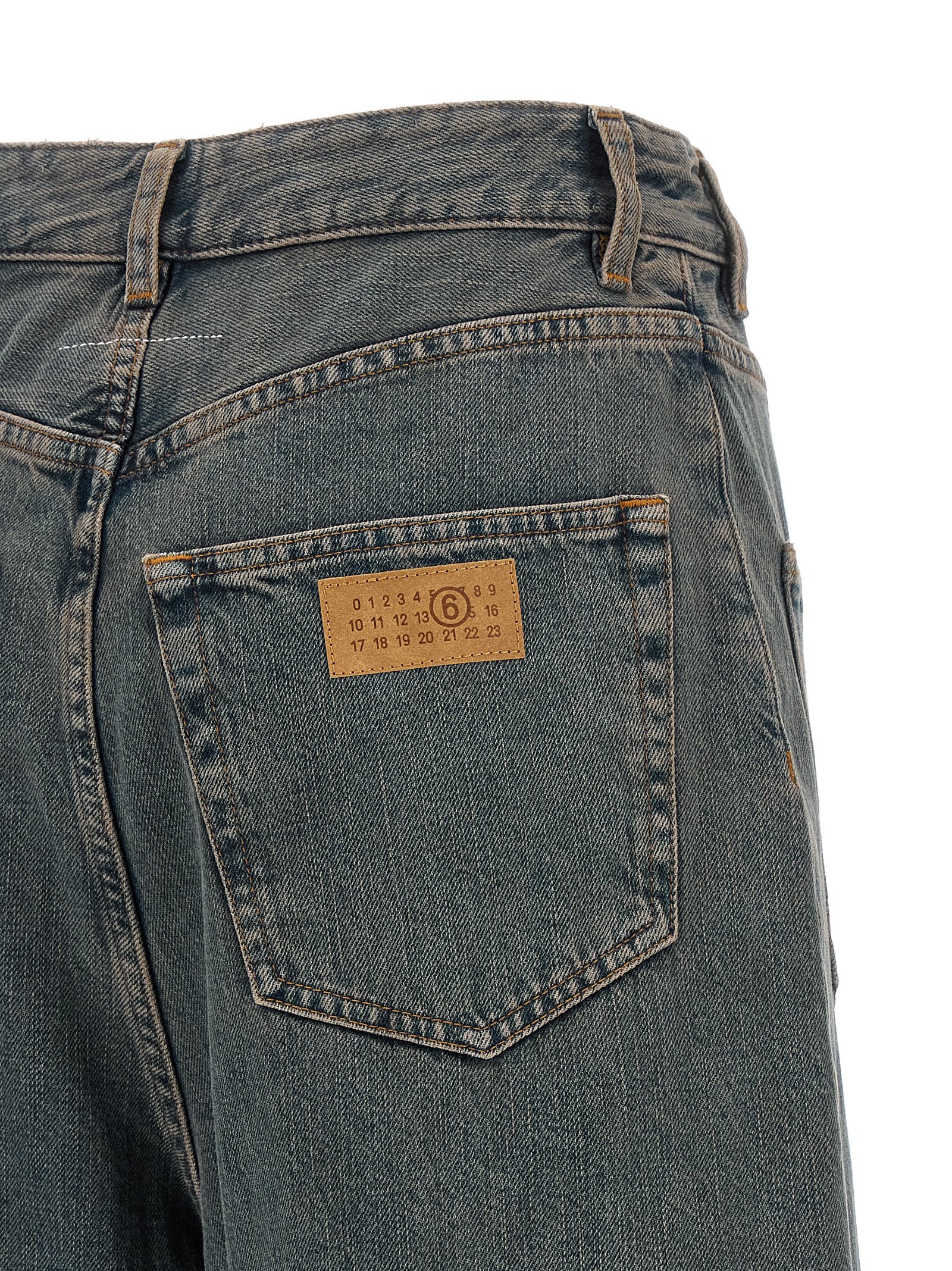 Jeans by MM6 Maison Margiela for women in cotton denim gradient, gray & white presents a refined pantology silhouette, artfully defined by a refined pantology wide, long, and a sophisticated .