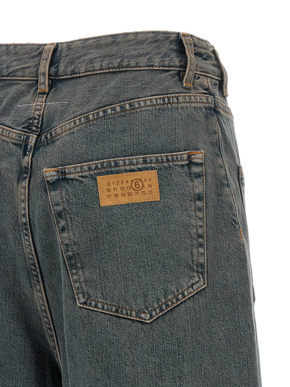 Jeans by MM6 Maison Margiela for women in cotton denim gradient, gray & white presents a refined pantology silhouette, artfully defined by a refined pantology wide, long, and a sophisticated .
