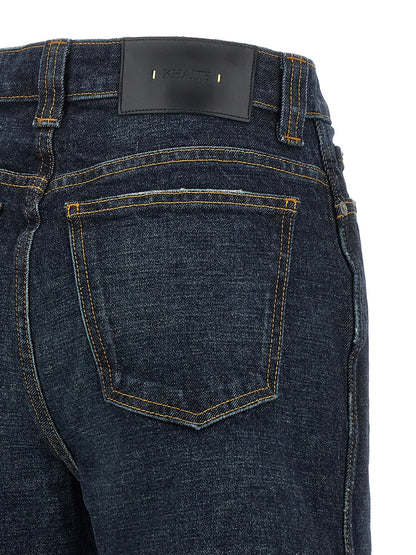 Jeans by Khaite for women in polyurethane leather & cotton denim blue presents a refined pantology silhouette, artfully defined by a refined pantology flared & wide, long, and a sophisticated high rise.
