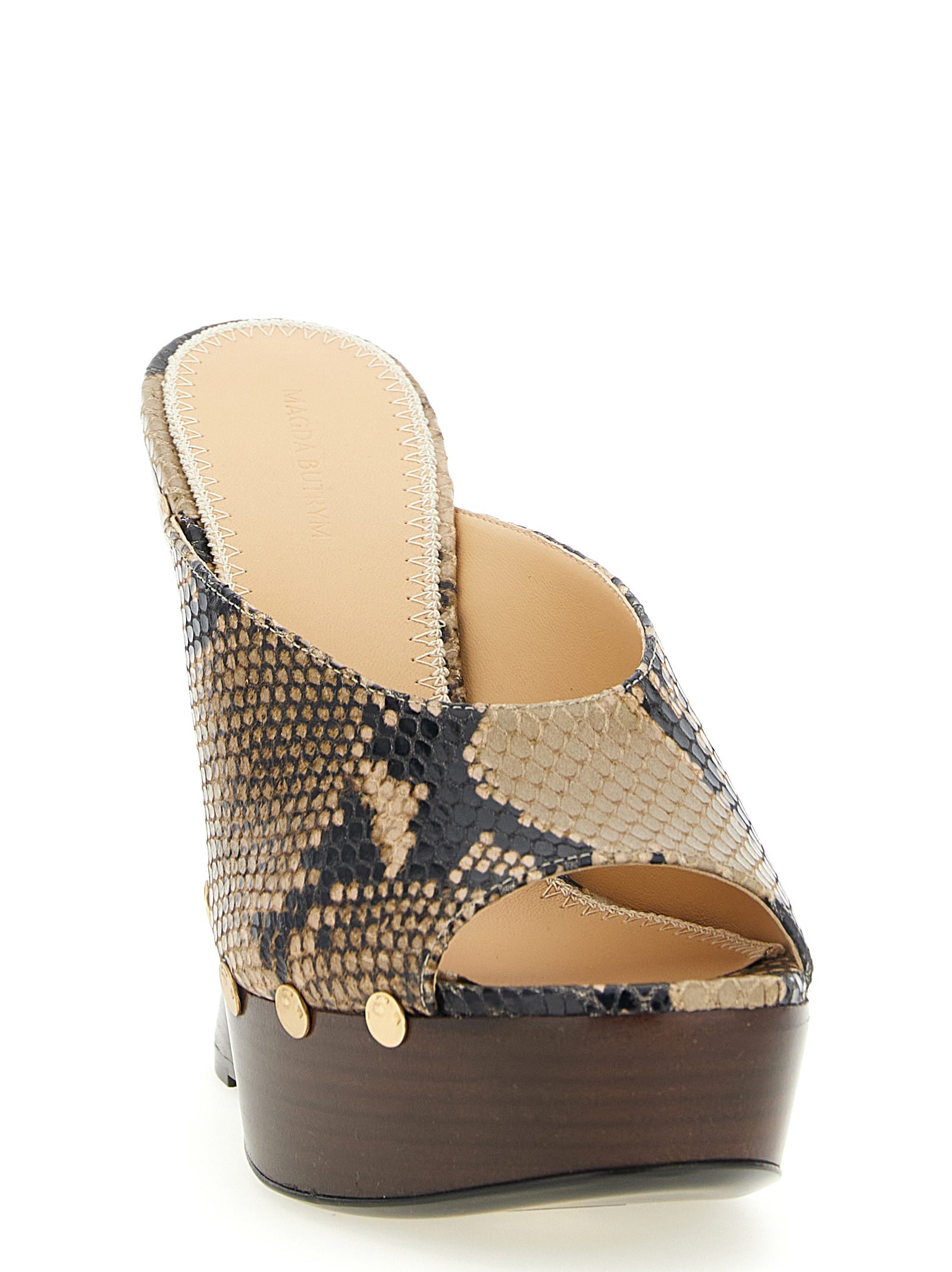 Wedge Mules Sandals by Magda Butrym for women in bos taurus calfskin python leather and brown, gold, natural & print presents a captivating silhouette, showcasing the signature style of the Women's Bos Taurus Calfskin Python Leather Wedge Mules Sandals with a captivating wedge and captivating .