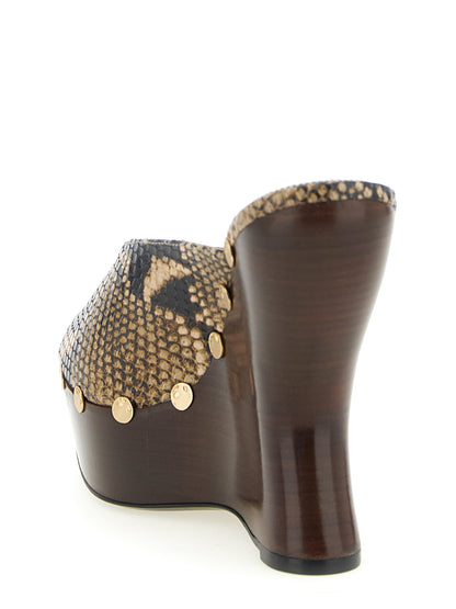 Wedge Mules Sandals by Magda Butrym for women in bos taurus calfskin python leather brown, gold, natural & print features an effortlessly chic silhouette from the Women's Bos Taurus Calfskin Python Leather Wedge Mules Sandals collection, showcasing a effortlessly chic wedge and elegant .
