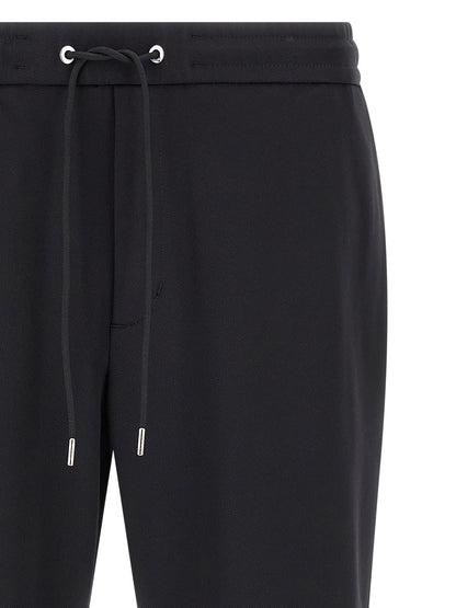 Joggers by Moncler for men in polyamide felt black features a refined silhouette with a refined tapered-leg, defined by a and a refined long for a refined finish.