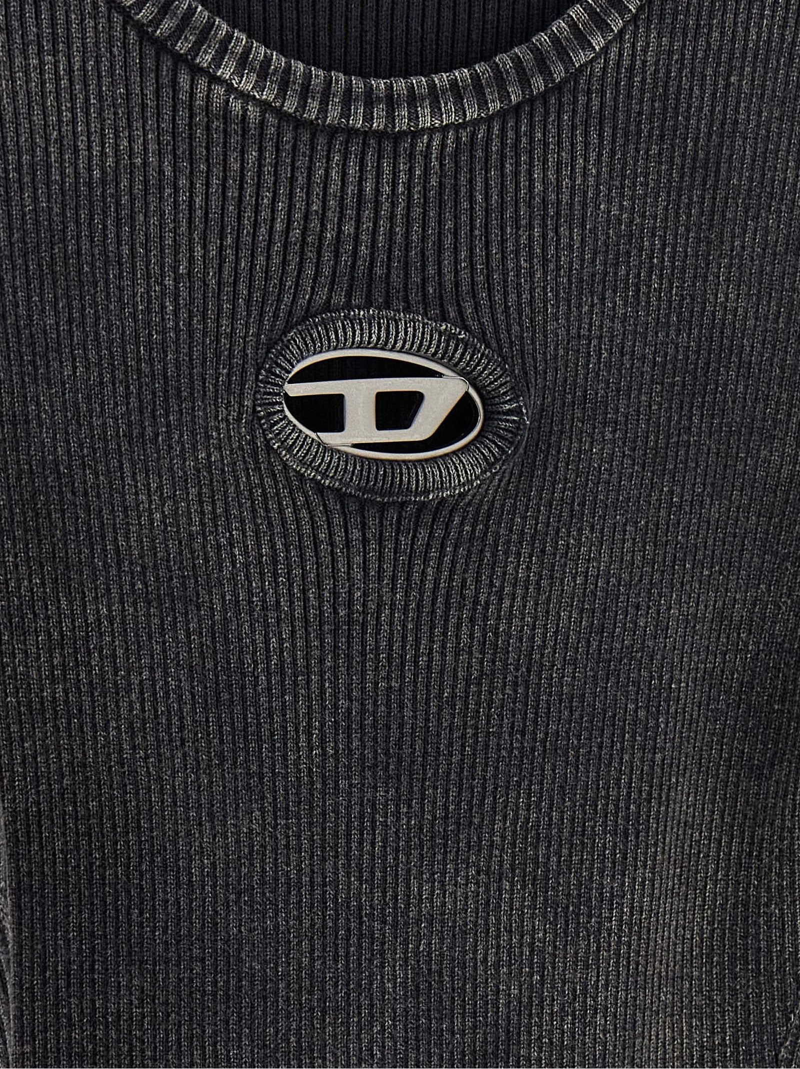 Dress by Diesel for women in cotton black features an magnificent silhouette, artfully detailed with a magnificent and that flows into an magnificent short mini.