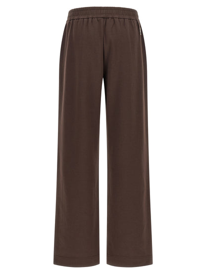 Joggers by Moncler for women in cotton felt brown presents a refined pantology silhouette, artfully defined by a refined pantology relaxed-fit & wide, long, and a sophisticated .