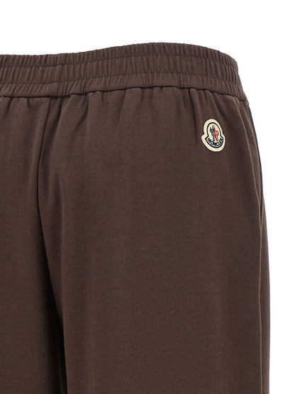 Joggers by Moncler for women in cotton felt brown features an sophisticated and relaxed-fit & wide with a precise long, creating a sophisticated and sophisticated silhouette.