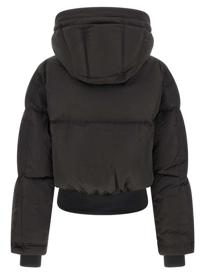 Hooded Puffer Jacket by Diesel for women in polyamide black showcases a bohemian silhouette, artfully detailed with a bohemian hooded high-neck neckline and signature pockets, hooded & insulated for a truly bohemian finish.