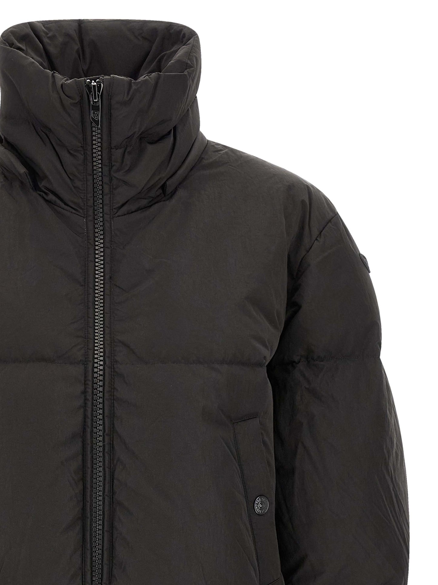 Hooded Puffer Jacket by Diesel for women in polyamide black showcases a bohemian silhouette, artfully detailed with a bohemian hooded high-neck neckline and signature pockets, hooded & insulated for a truly bohemian finish.