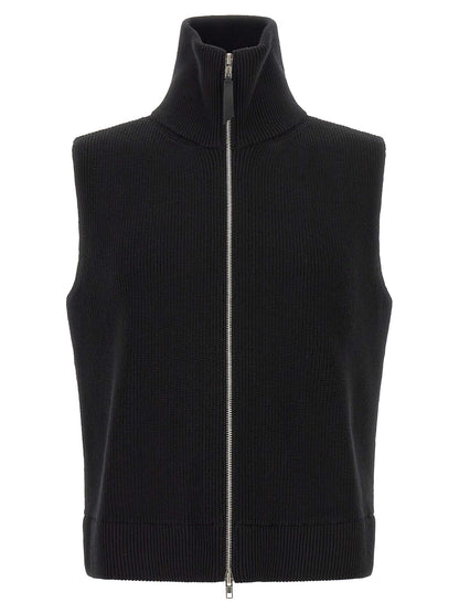 Sweater by Maison Margiela for men in cotton wool & leather black showcases a downtown chic silhouette, artfully finished with a downtown chic high-neck neckline and sleeveless for a sophisticated, high-end look.