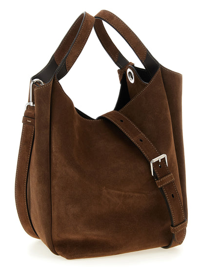 Bucket Handbag by Tod's for women in calfskin leather brown & silver presents a ornamental silhouette, showcasing a secure , ample , and versatile shoulder-strap, handle & adjustable-strap for a ornamental finish.
