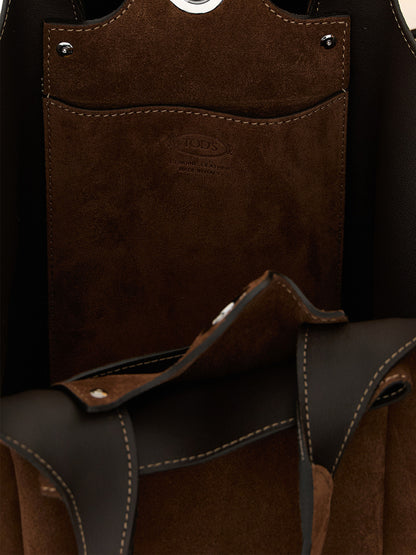 This Bucket Handbag by Tod's for women in calfskin leather and brown & silver presents a sculptural silhouette featuring a secure , ample , and versatile shoulder-strap, handle & adjustable-strap for a sculptural finish.