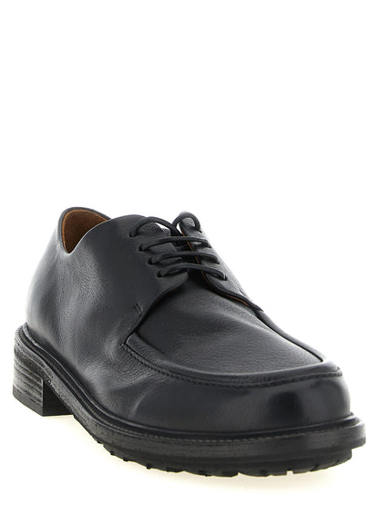 Derby Shoes by Marsell for men in calfskin leather black features an ergonomic silhouette, perfectly showcasing Men's Calfskin Leather Derby Shoes with its distinct and elegant .