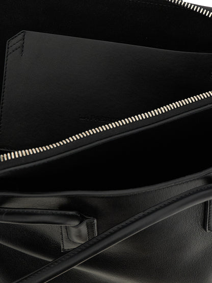 Medium Shoulder Bag by The Attico for women in calfskin leather black features a enviable silhouette, showcasing a secure zipper, ample external-pockets, and enviable shoulder-strap & handle for a enviable finish.