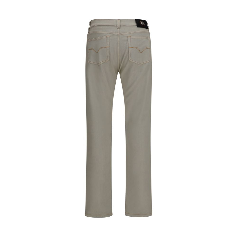 Jeans by Versace for men in stretch denim cotton beige presents a refined pantology silhouette, artfully defined by a refined pantology tapered-leg & slim, long, and a sophisticated .