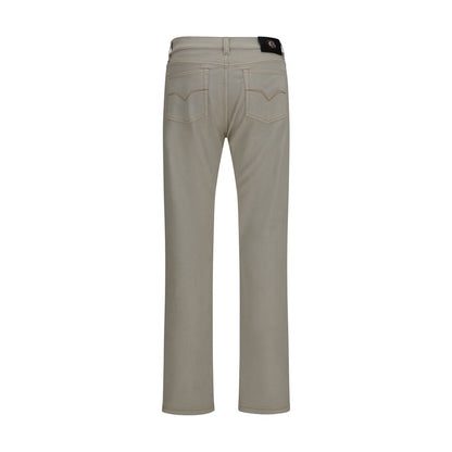 Jeans by Versace for men in stretch denim cotton beige presents a refined pantology silhouette, artfully defined by a refined pantology tapered-leg & slim, long, and a sophisticated .
