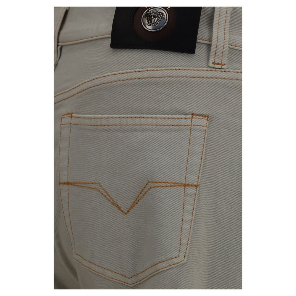 Jeans by Versace for men in stretch denim cotton beige features an sophisticated and tapered-leg & slim with a precise long, creating a sophisticated and sophisticated silhouette.