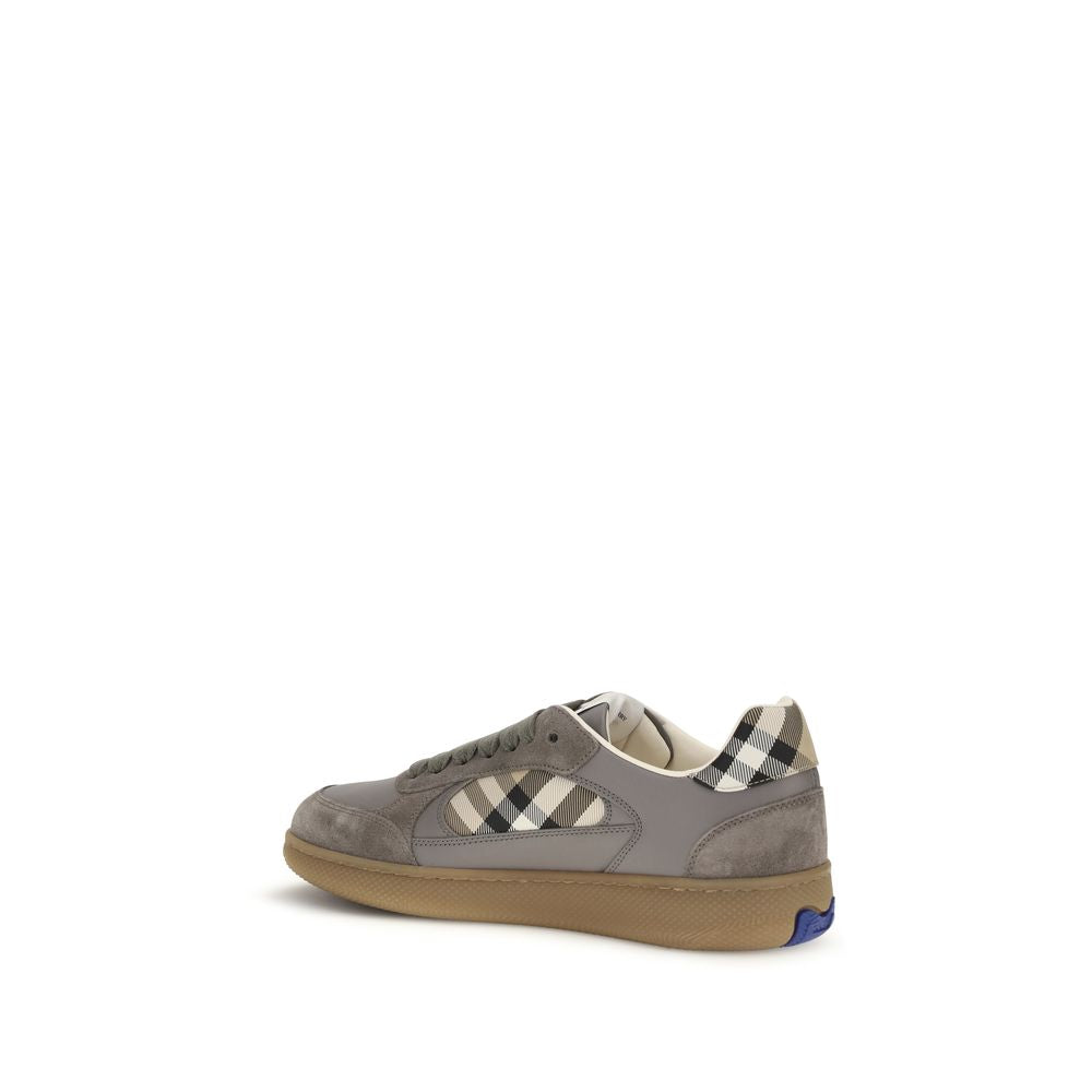 Sneakers by Burberry for men in bos taurus calf suede leather blue, gray & patterned presents a sumptuous silhouette, artfully capturing the essence of the Men's Low Top Bos Taurus Calf Suede Leather Sneakers with its sumptuous low-top style design.