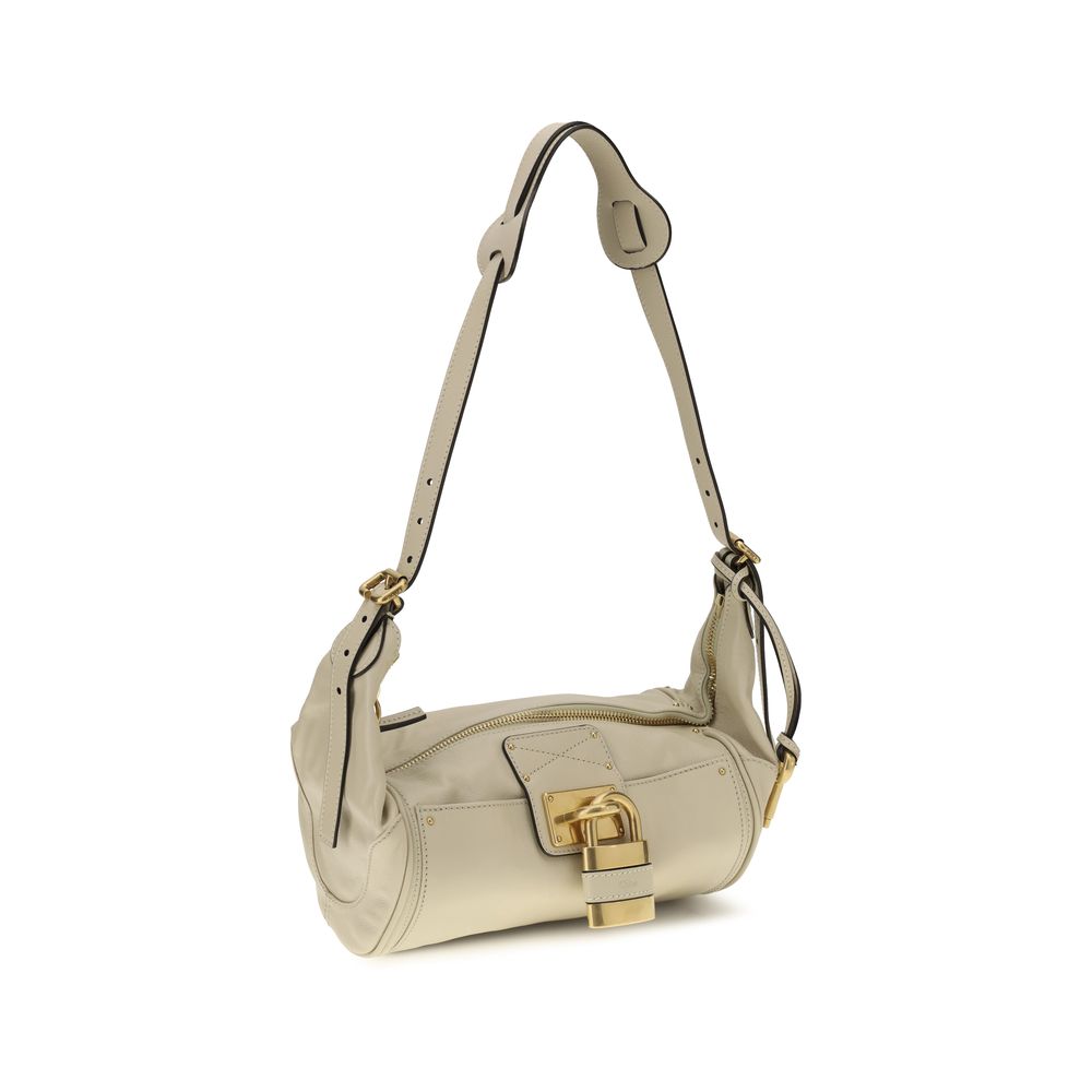 Small Shoulder Bag by Chloé for women in bos taurus calf leather beige & signature presents a versatile silhouette, showcasing a secure zipper & buckle and versatile with versatile shoulder-strap for a sophisticated look.