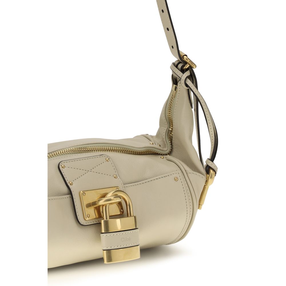 Small Shoulder Bag by Chloé for women in bos taurus calf leather beige & signature features a effortless chic silhouette with a secure zipper & buckle, ample , and versatile shoulder-strap for a effortless chic finish.