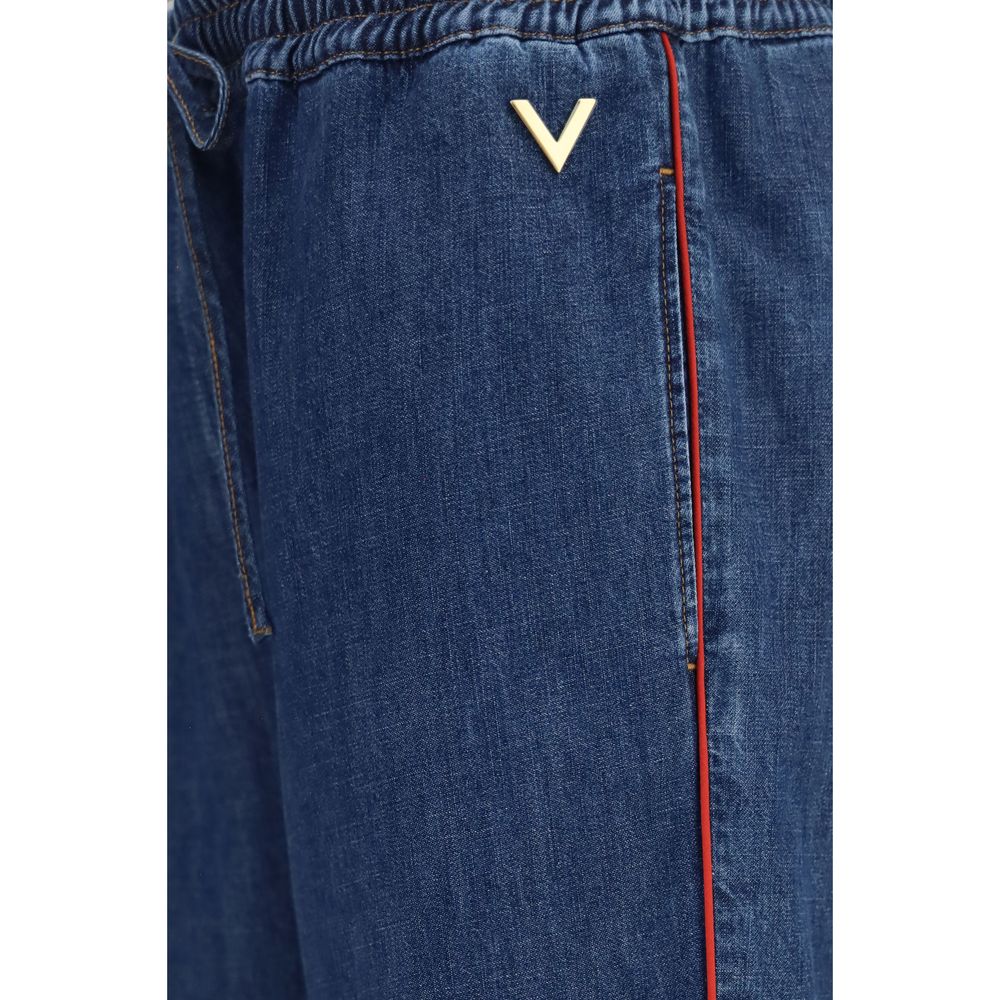 Casual Pants by Valentino Garavani for women in polyester cotton denim blue, red & striped features an sophisticated and straight-leg, relaxed-fit, wide & oversized with a precise long, creating a sophisticated and sophisticated silhouette.