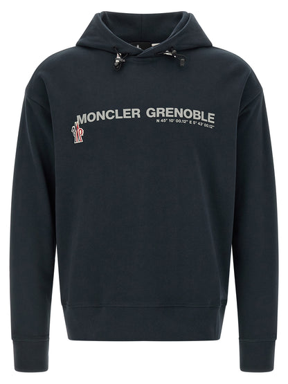 Sweatshirt Hoodie by Moncler Grenoble for men in cotton blue & print showcases a city-ready silhouette, artfully detailed with a signature hooded neckline and long-sleeve for a city-ready finish.