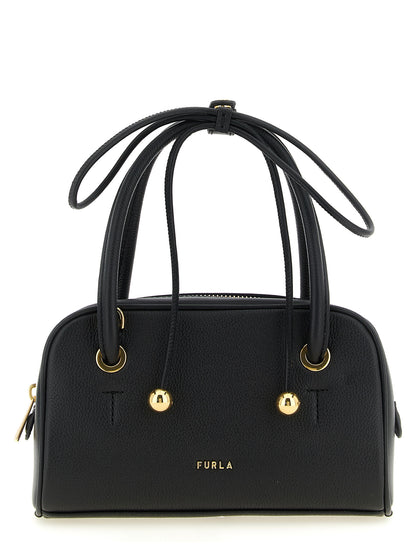 This Compact Handbag by Furla for women in bos taurus calf suede leather and black & gold presents a sculptural silhouette featuring a secure zipper, ample , and versatile shoulder-strap, adjustable-strap & handle for a sculptural finish.
