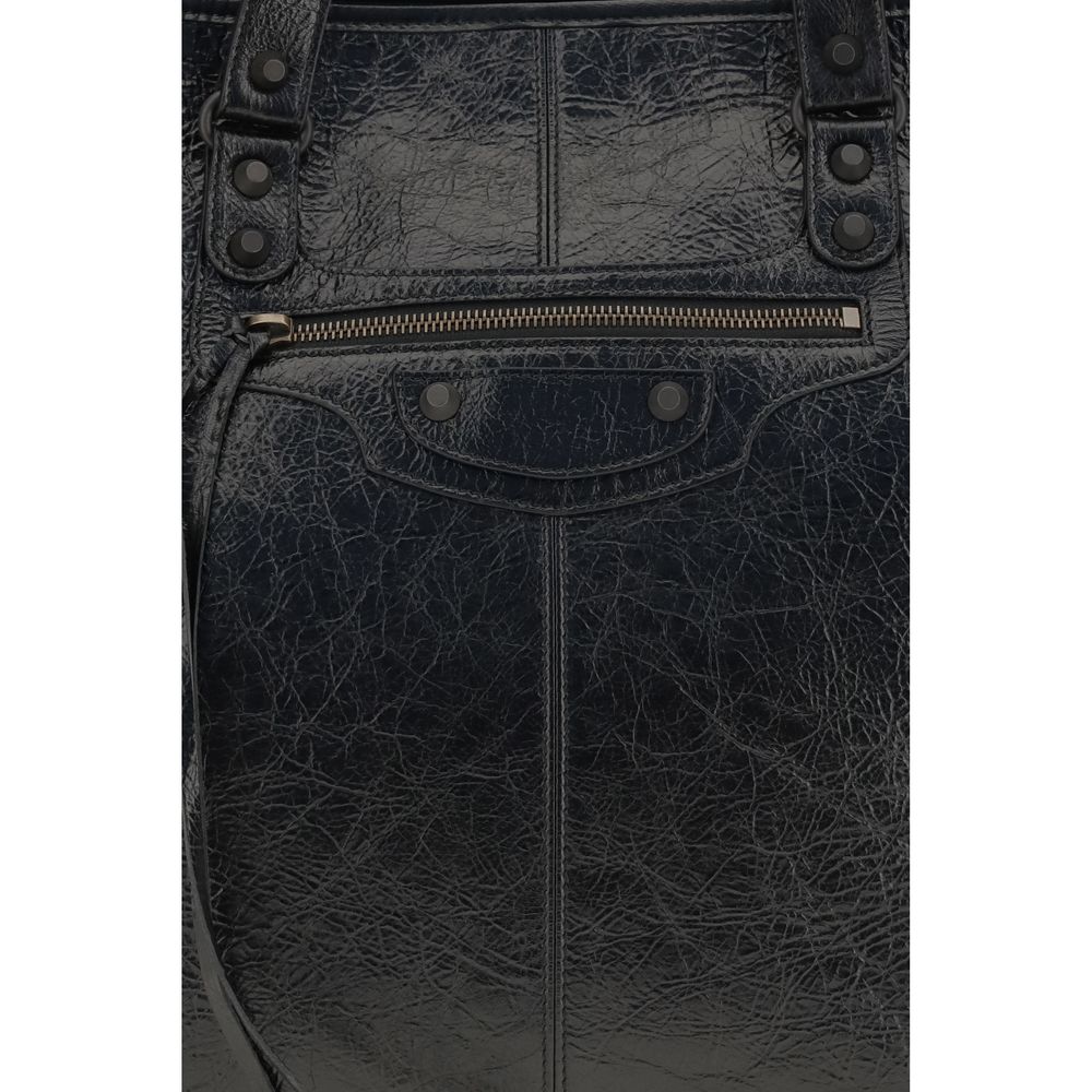 Tote Shoulder Bag by Balenciaga for men in lambskin leather black presents a versatile silhouette, showcasing a secure zipper & magnetic and versatile with versatile handle for a sophisticated look.