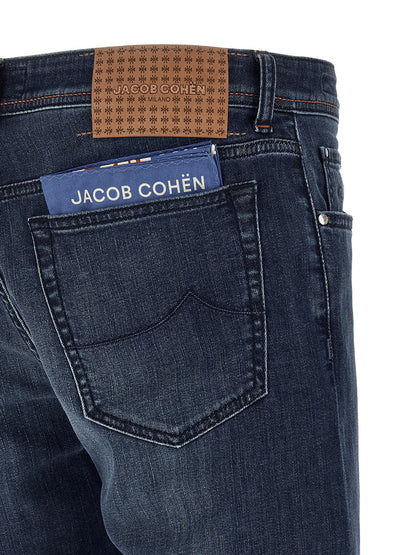 Jeans by Jacob Cohen for men in stretch denim cotton blue features a refined silhouette with a refined straight-leg & slim, defined by a mid rise and a refined long for a refined finish.
