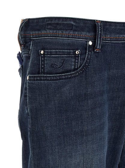 Jeans by Jacob Cohen for men in stretch denim cotton blue presents a refined pantology silhouette, artfully defined by a refined pantology straight-leg & slim, long, and a sophisticated mid rise.