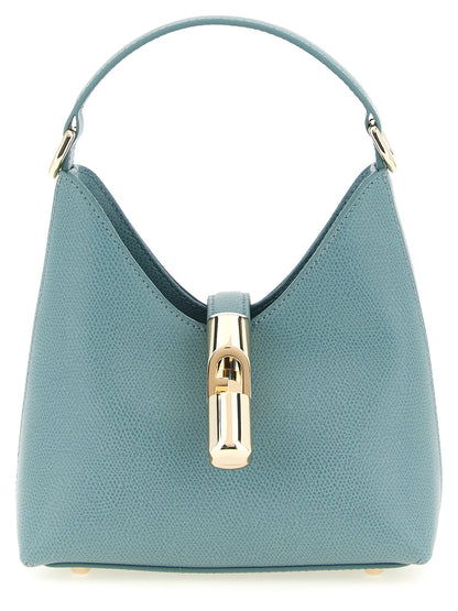 This Mini Handbag by Furla for women in calfskin leather and gold, light-blue & signature presents a sculptural silhouette featuring a secure zipper, ample , and versatile shoulder-strap, handle & adjustable-strap for a sculptural finish.