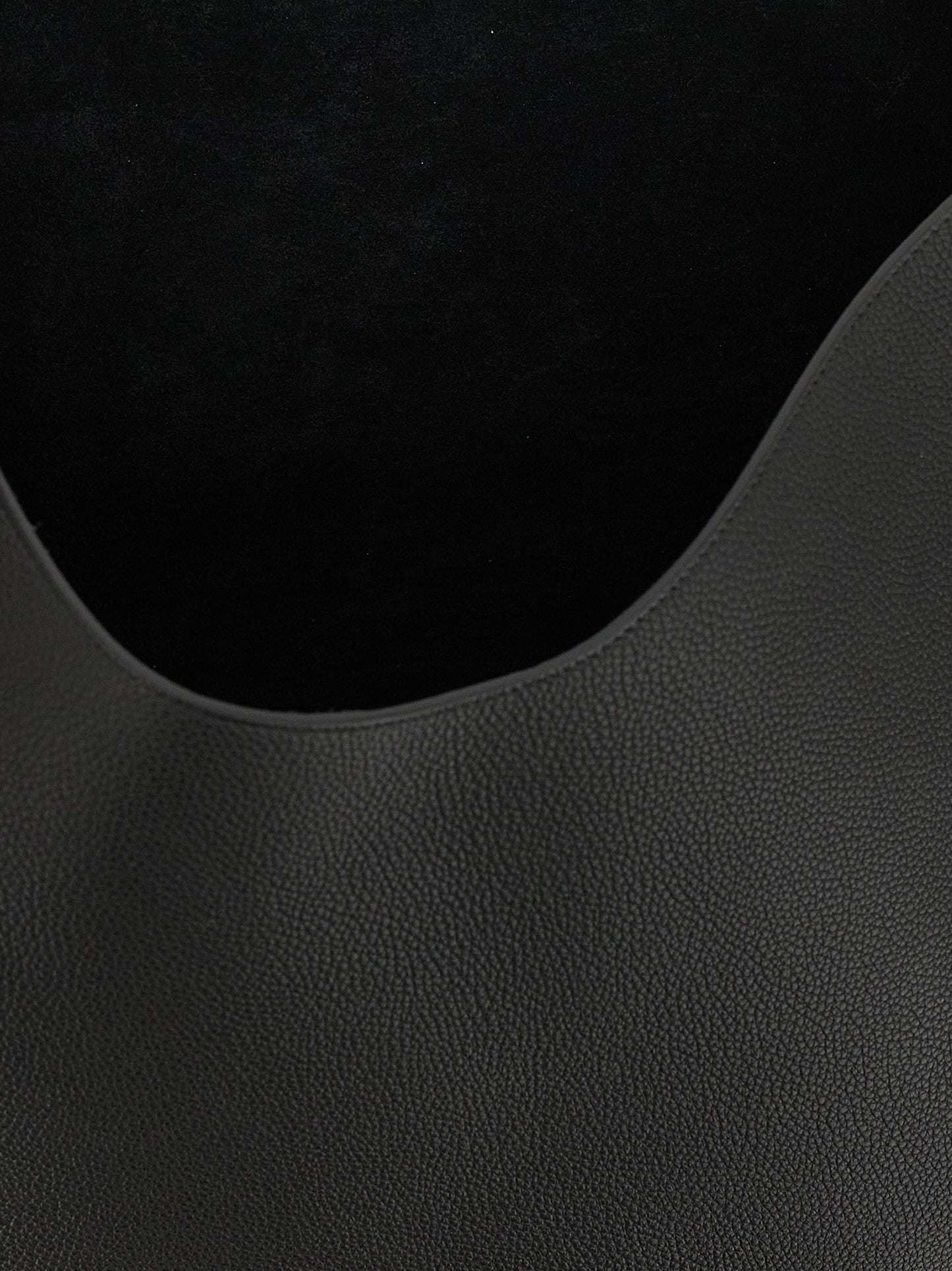 Tote Clutch Bag by Khaite for women in bos taurus calfskin leather black & gold features a jet-set sophisticated Lotus Bos Taurus Calfskin Leather Tote Clutch Bag design with a secure , ample , and versatile handle for a jet-set sophisticated finish.
