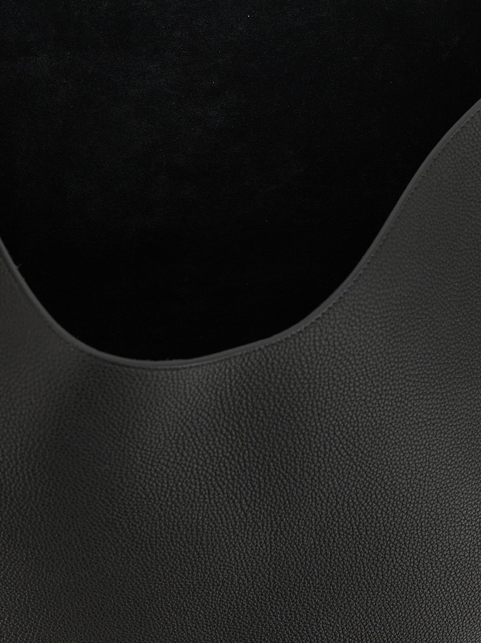 Tote Clutch Bag by Khaite for women in bos taurus calfskin leather black & gold features a jet-set sophisticated Lotus Bos Taurus Calfskin Leather Tote Clutch Bag design with a secure , ample , and versatile handle for a jet-set sophisticated finish.