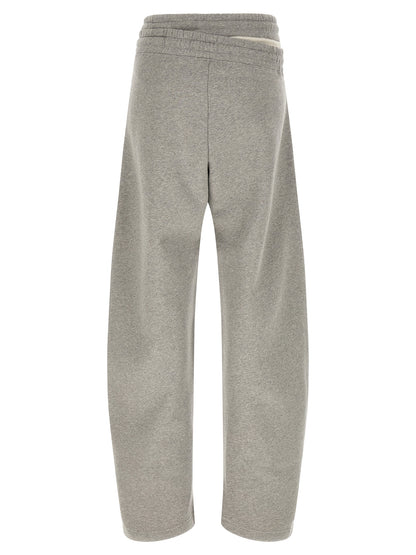 Casual Pants by The Attico for women in cotton gray features a polished silhouette with a polished relaxed-fit & wide, reaching a polished long and finished with a polished .