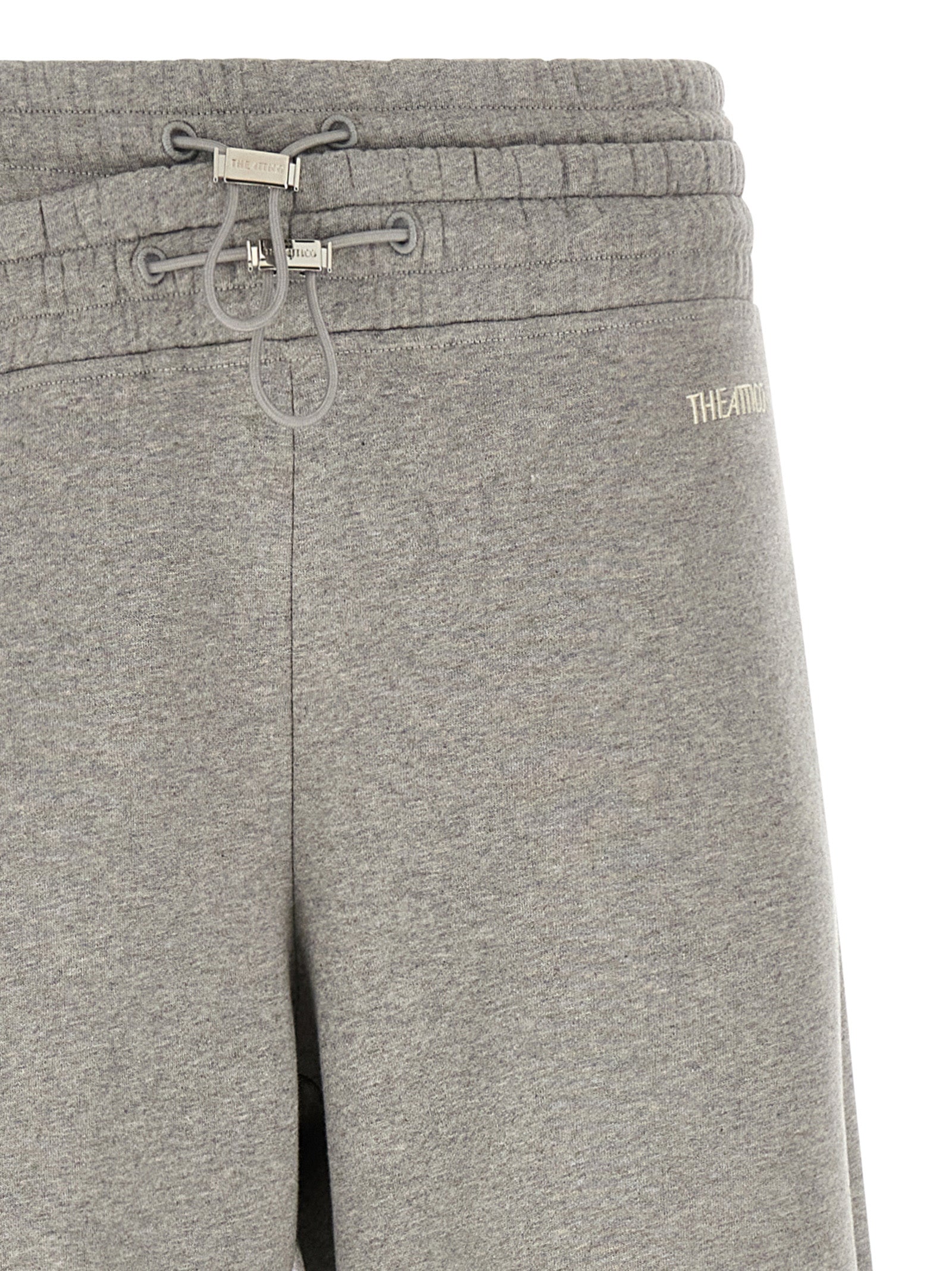 Casual Pants by The Attico for women in cotton gray presents a tailored silhouette, showcasing a tailored relaxed-fit & wide and long cut with a refined for a truly tailored aesthetic.