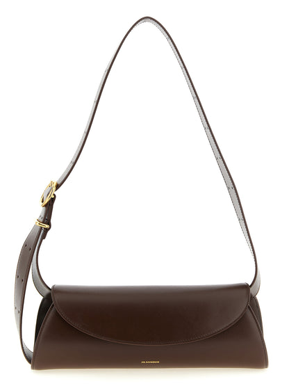 Small Shoulder Bag by Jil Sander for women in calfskin leather brown & gold presents a statuesque silhouette, showcasing a secure magnetic, buckle & button and statuesque with versatile shoulder-strap & adjustable-strap for a sophisticated look.